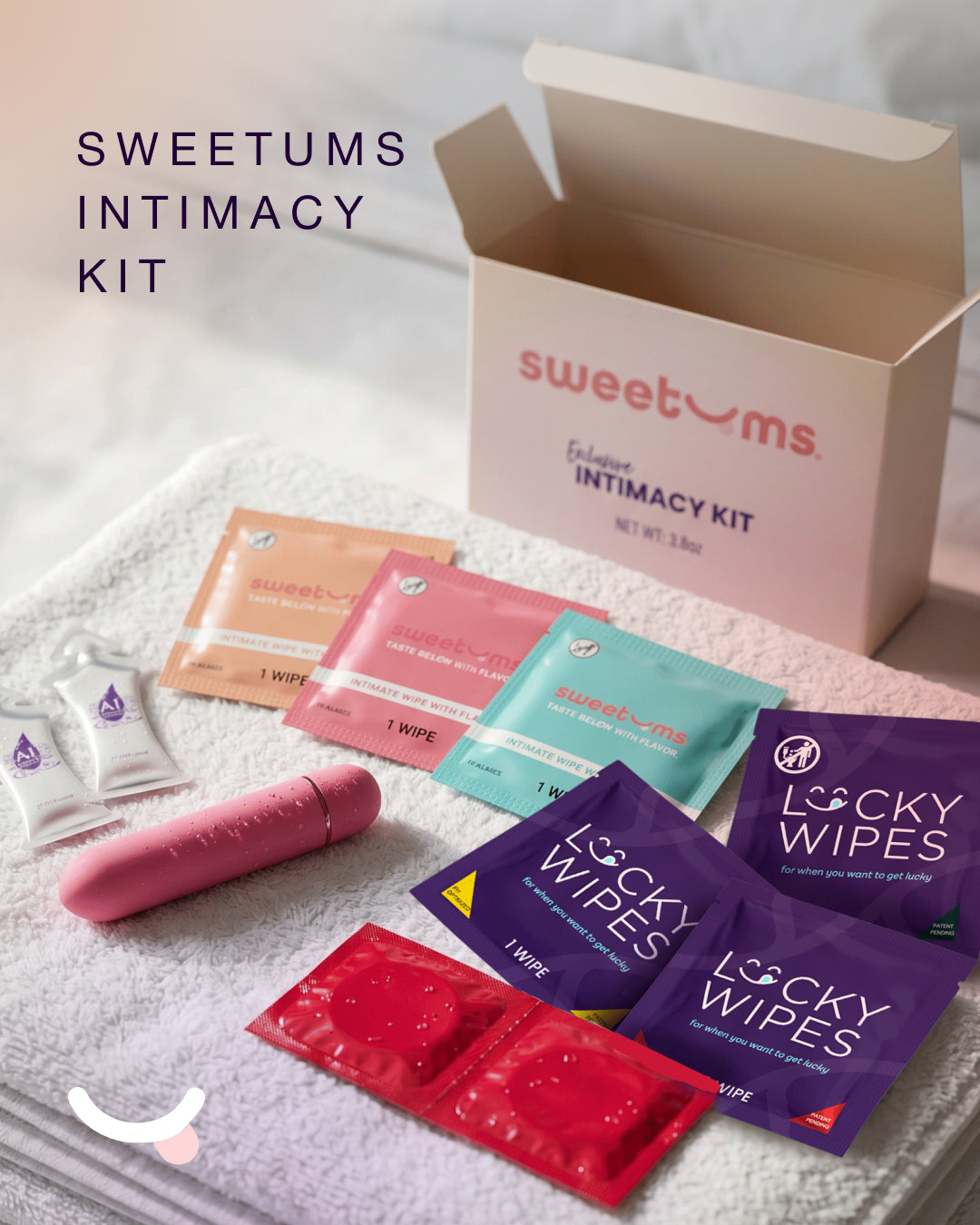 Sweetums Intimacy Kit with various products on a towel